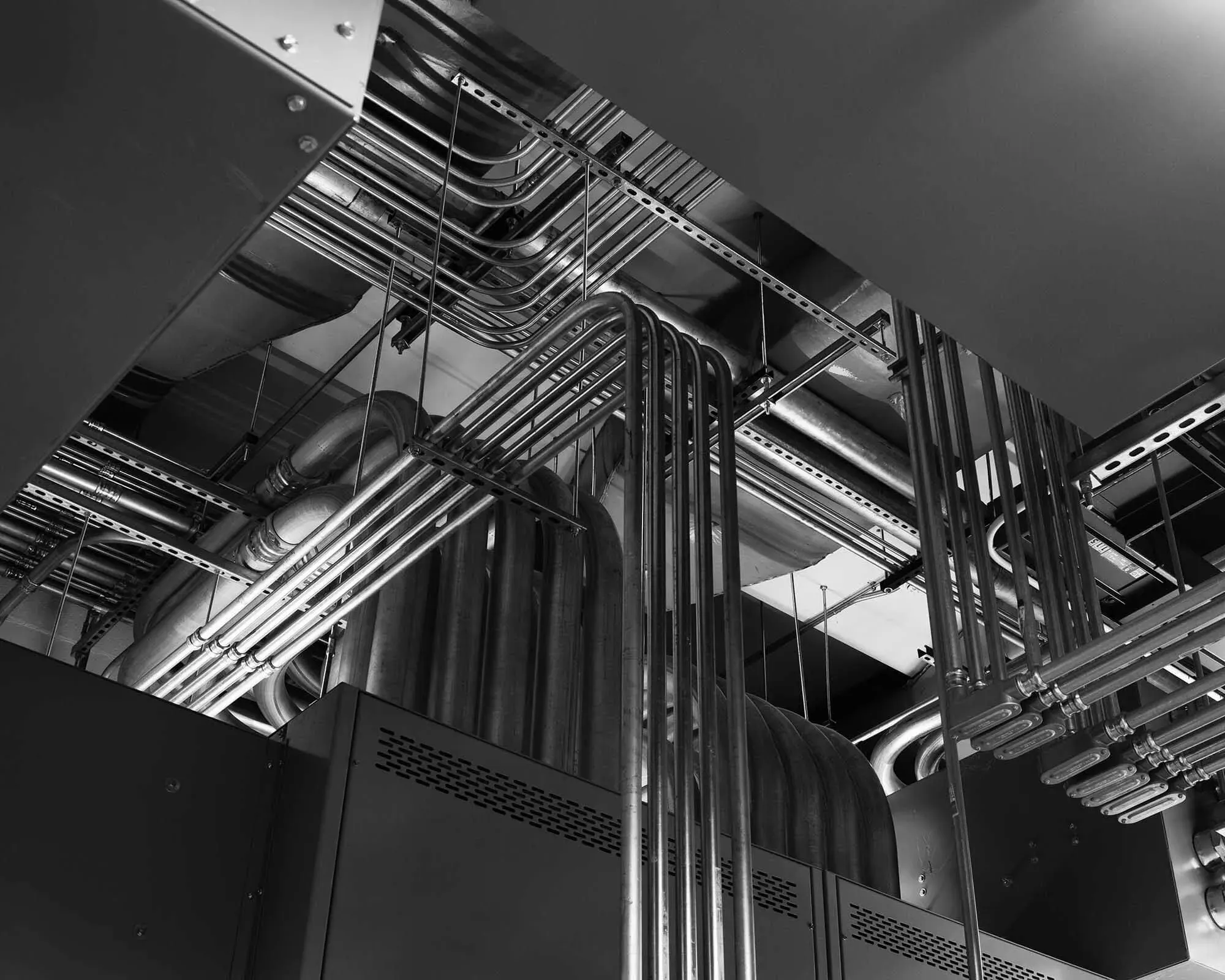 Electrical conduit running overhead in a commercial building